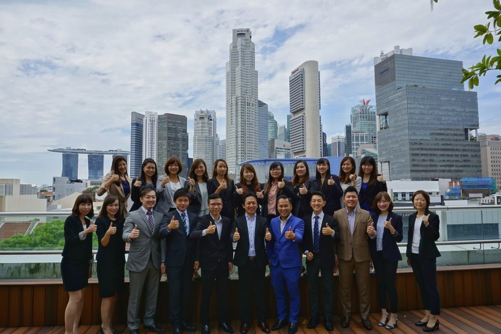 A group photo at the company. Everyone is smiling happily!